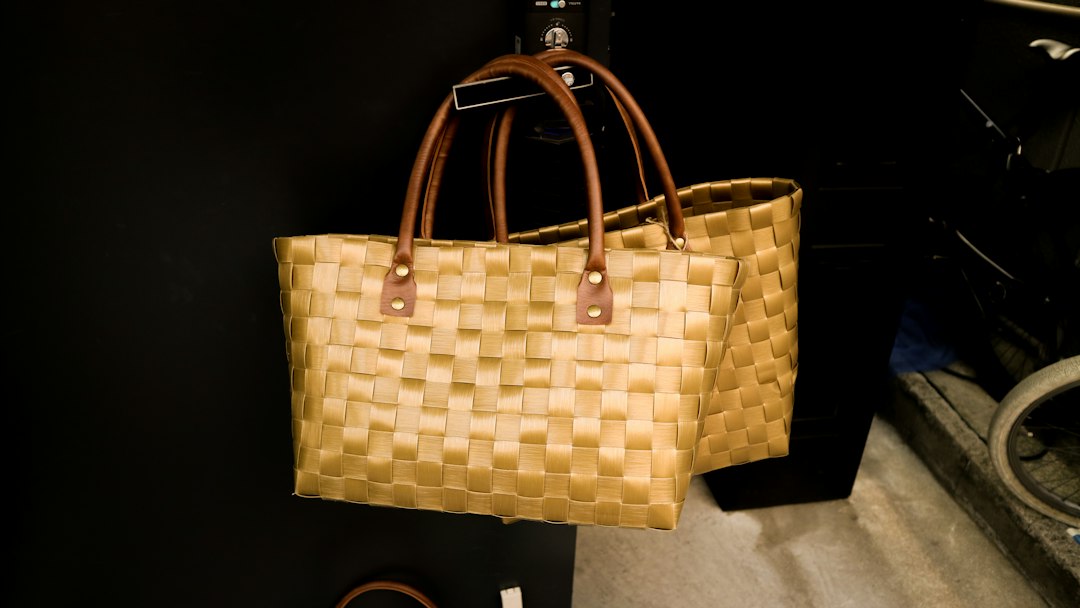 A stack of woven beach bags in natural fibres